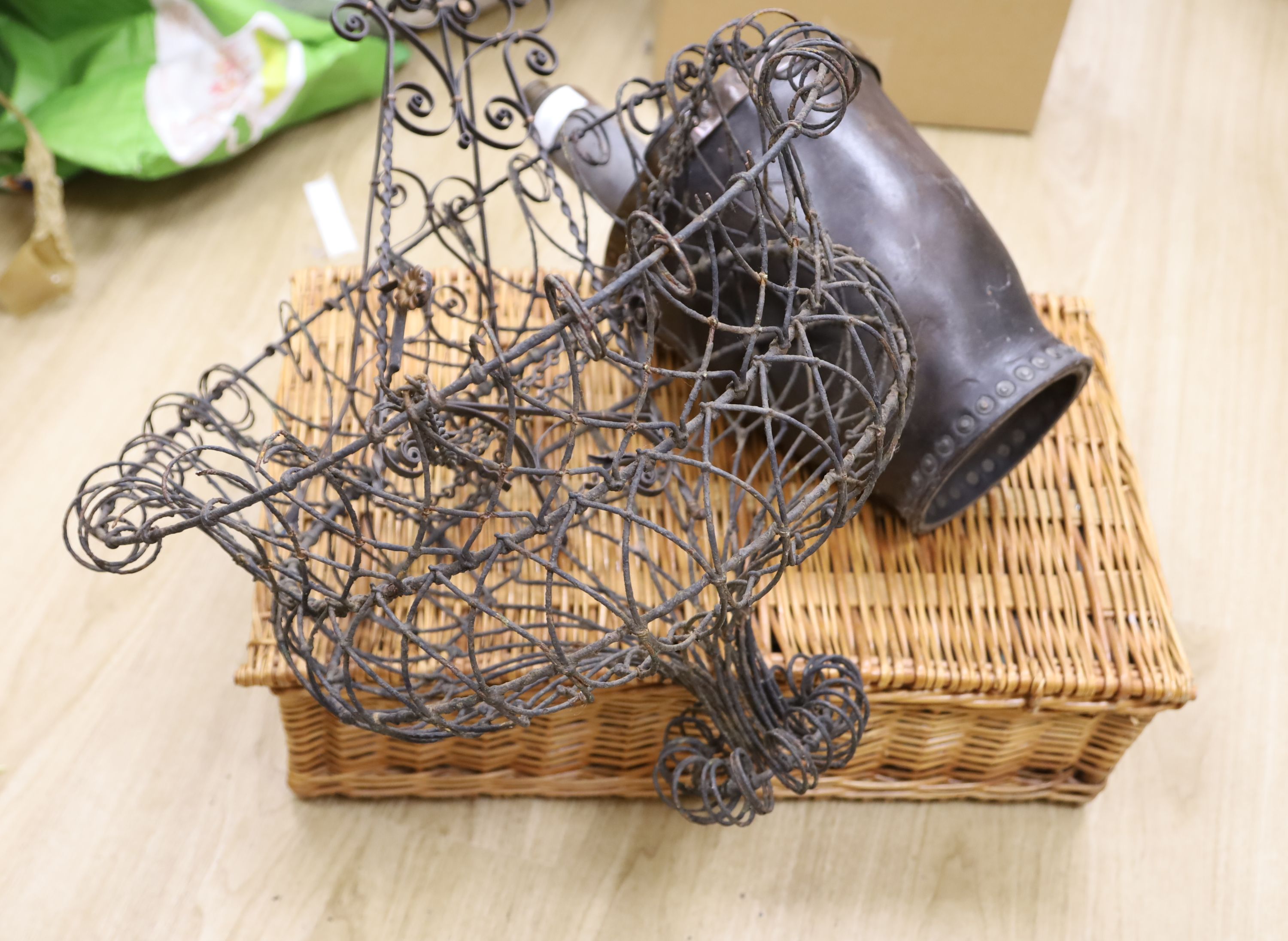 A wirework hanging basket, a fire bucket, a telescope, an easel and a picnic basket